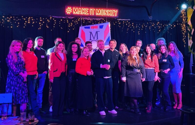 Guests of the 3rd Space Bucharest launch party gathered on stage for a group photo