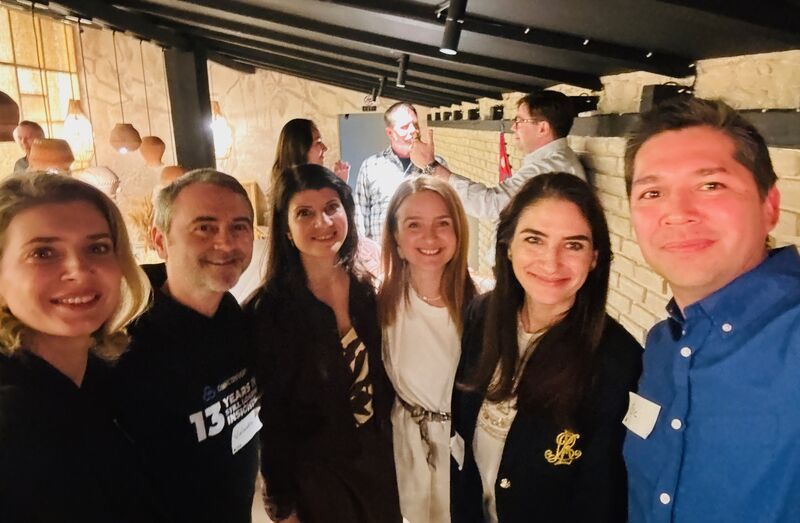 Smiling guests in a group selfie at a 3rd Space Bucharest event