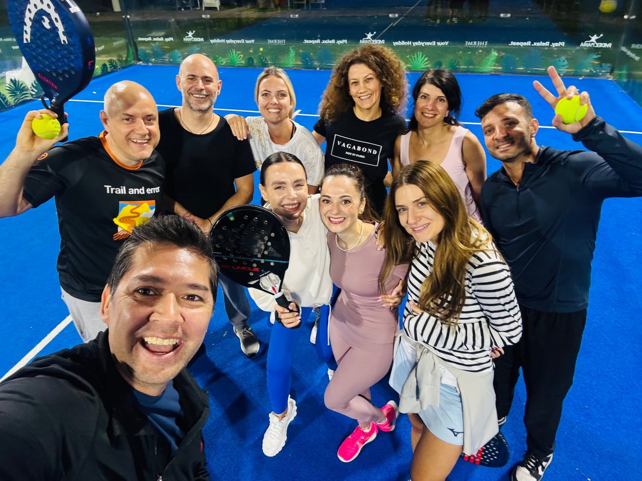 The 3rd Space AI Circle group on a blue padel court at PadelMania Romania in Bucharest