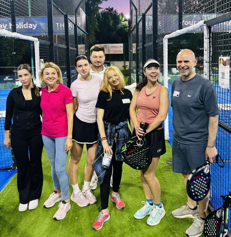 Guests posing on the padel court at the second 3rd Space Bucharest Padel & Prosecco night