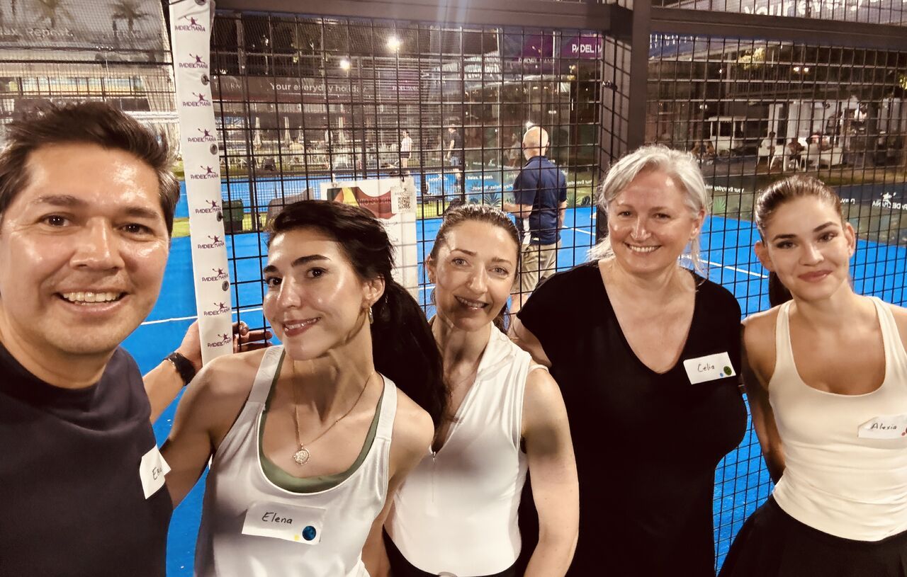 Eric Melchor with guests on a lit padel court in Bucharest