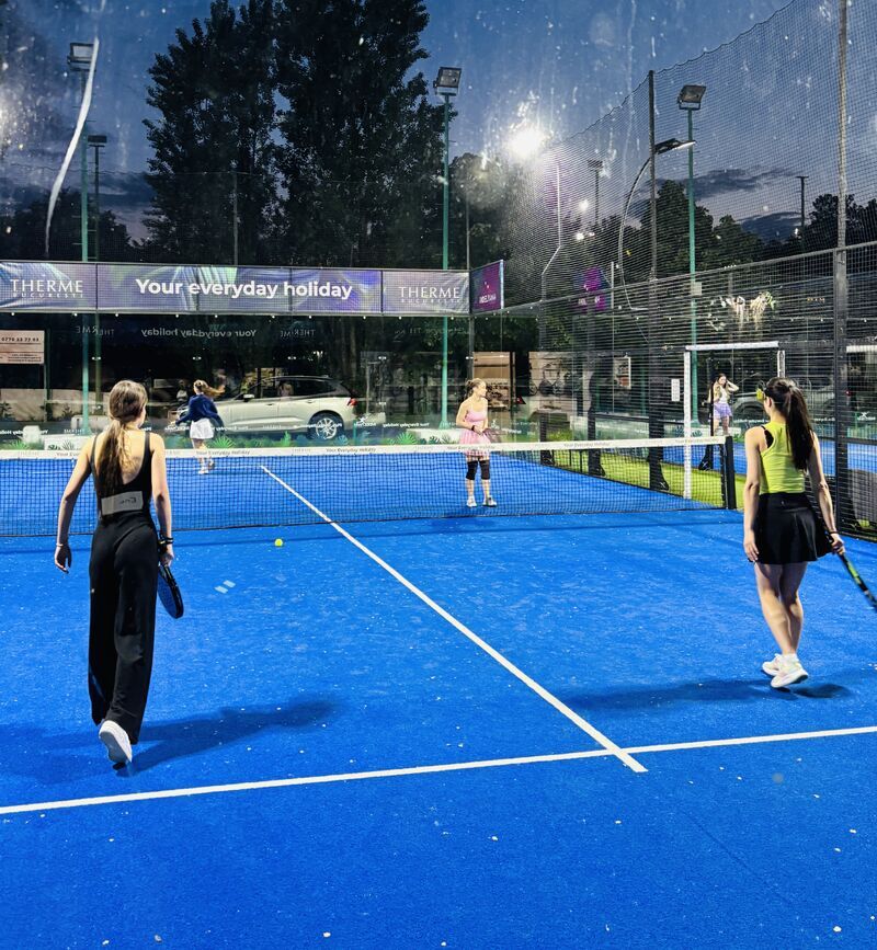 A padel match under the floodlights in Bucharest