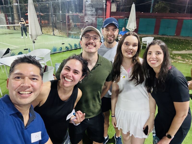 Group selfie on the padel court at the King of the Court social