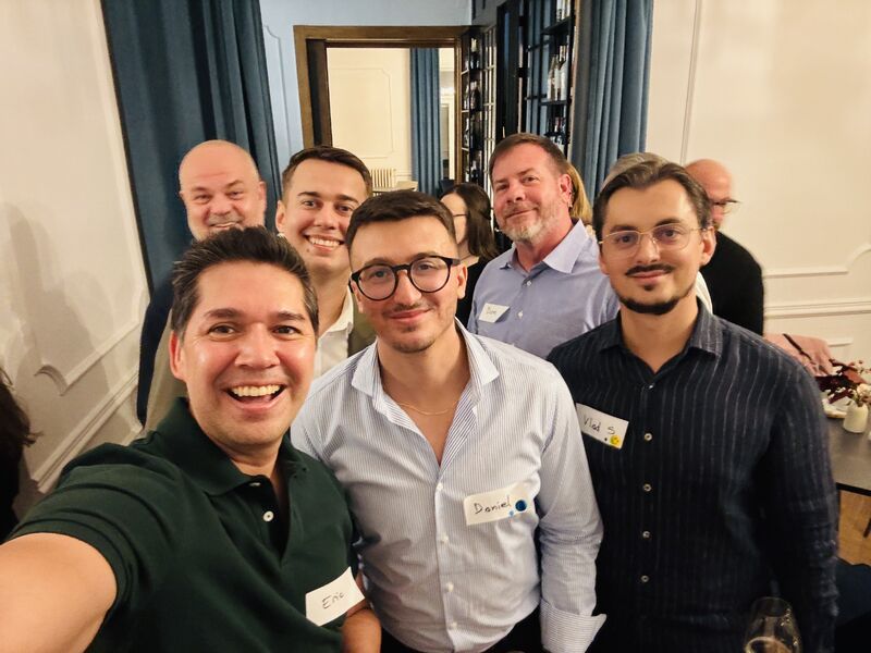 Eric Melchor taking a selfie with guests at the headshot party